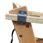 Load image into Gallery viewer, Zoomed in view of a metallic lock that keeps the tray in place for children's wooden high chair