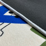 Load image into Gallery viewer, Sticky dots for additional safety beneath a children's carpet with colorful English alphabet illustration and cartoon characters
