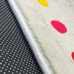 Load image into Gallery viewer, Sticky dots for additional safety beneath a children's carpet with colorful English alphabet illustration and cartoon characters
