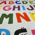 Load image into Gallery viewer, Zoomed in English alphabet illustration and cartoon characters in a children's carpet
