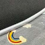 Load image into Gallery viewer, Sticky dots for additional safety on the underside of a children's round carpet with a small town design
